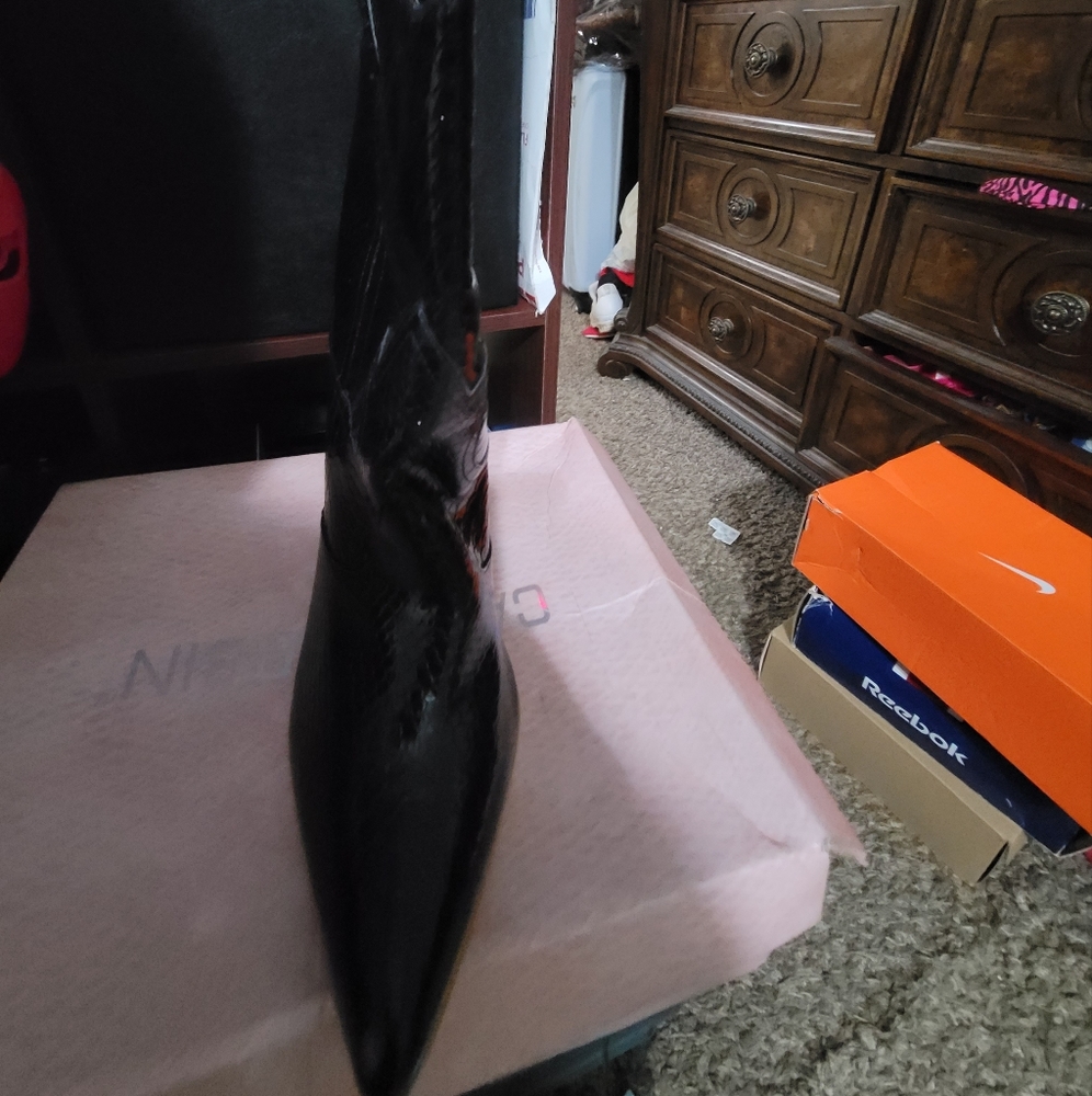 Black, shiny, cowboy styled boot